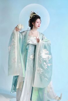 For the goddess of the moon, this gorgeous Tang Dynasty inspired set is adorned head to toe with embroideries of peonies, dragons and protection lions. Not one corner is neglected! From the wrists to the back, envelop yourself in the luxuries of high quality flowers. The Daxiushan (大袖衫, wide sleeved jacket) is dramatic and elegant, creating movement and grace with its exaggerated sleeves. A large protective lion upon the center of the jacket has got your back - literally! The star of the show is Edo Japan, Ap Portfolio, Goddess Of The Moon, Goddess Outfit, Chinese Princess, Modern Hanfu, Exaggerated Sleeves, Tang Dynasty, Body Figure