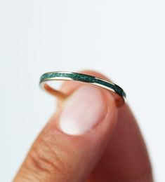 Best seller at Capucinne - Unisex wedding band with an emerald inlay. A modern & simple wedding band for him or her. Price is for 2mm wide band. The width of the band can be changed per request. Details Gemstone: crushed genuine emerald, Gemstone Wedding Band, Conservative Style, Wedding Band For Him, Simple Wedding Band, Emerald Wedding Band, Simple Wedding Bands, Emerald Band, Wedding Bands For Him, Green Gemstone Ring