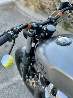 a close up of a motorcycle mirror on the handlebars