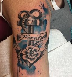 a tattoo with an anchor, heart and family ribbon on the arm is shown in blue watercolors