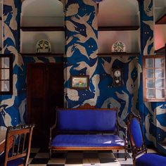 a living room with blue and white walls