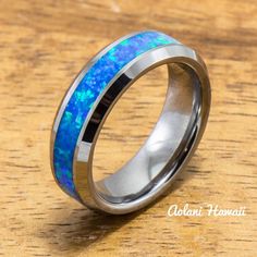 a wedding ring with an opal inlay