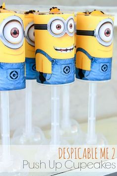 three despicable me minion cupcakes sitting on top of each other