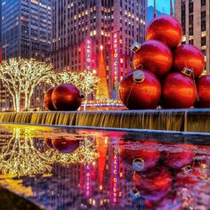 the christmas decorations are reflecting in the water