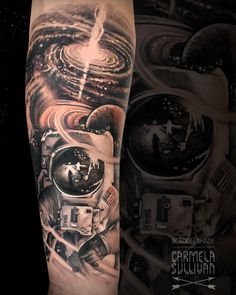 an astronaut tattoo on the arm with space and stars around it, in black and white