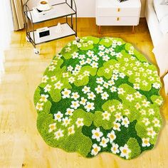 a green rug with white daisies and clover leaves on it in a living room