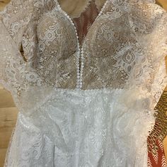 a woman's white dress on display in a store