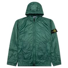 Stone Island’s latest packable jacket starts off with a blend of polyamide and is treated with a layer of PrimaLoft padding. The hooded jacket includes a garment-dyed aesthetic, while the jacket itself includes a drawstring hood along with hand pockets and a signature Stone Island badge at the left sleeve. The tightening snap at the cuffs, drawstring hem, ventilation eyelets, and two-way zipper closure complete the design.     Polyamide construction    PrimaLoft padding    Drawstring hood    Garment-dyed    Hand pockets    Stone Island badge    Tightening snap cuffs    Drawstring him    Ventilation eyelets    Two-way zipper closure    Style No: MO781542025 V0053     781542025 V0053 Stone Island Badge, Men Store, Packable Jacket, Green Brands, Running Jacket, Bottle Green, Green Man, Corduroy Jacket, Shearling Jacket