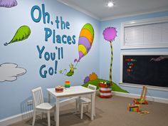 a child's playroom with dr seuss wall decals on the walls