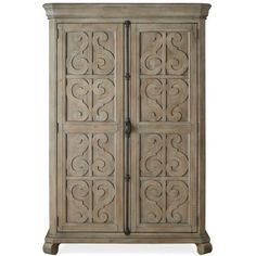 an antique style armoire with carvings on the front and side panels, made from wood