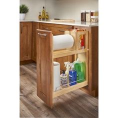 an open cabinet in the middle of a kitchen