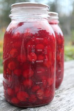 two mason jars filled with cherry pie filling