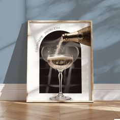 a glass of champagne being poured into it