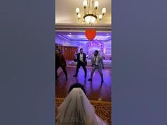 the bride and groom are dancing on the dance floor