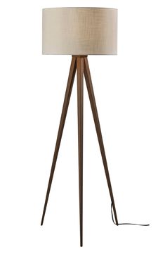 a wooden tripod floor lamp with a white shade