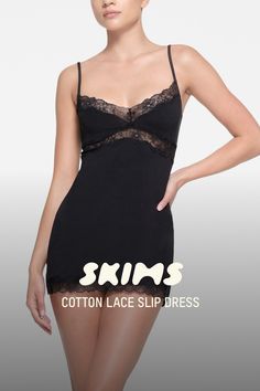 Slip into something sexier from SKIMS. This vintage-inspired lounge mini is designed in a premium, softer version of our signature cotton jersey for curve-hugging, breathable comfort. Made extra special with lace trim at the triangle neck, underbust, and hem. Features a crochet lace SKIMS logo at the center front and elastic straps that adjust. Fits true to size. | SKIMS Slip Dress | Black | Small | Cotton Lace Slip Dress Black, Lace Slip Dress, The Triangle, Grad Dresses, Dreamy Dress, Lace Slip, Black Xs, Lingerie Fashion, Cotton Lace