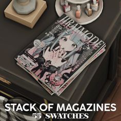 stack of magazines sitting on top of a table