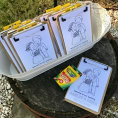 several clipboards with pictures on them are sitting on a table next to some candy