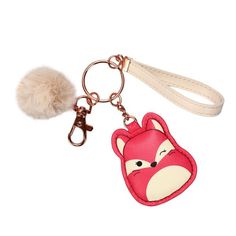 a keychain with a fox on it and a pom - pom