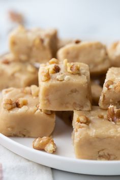 maple walnut fudge on a white plate with the title in black text above it