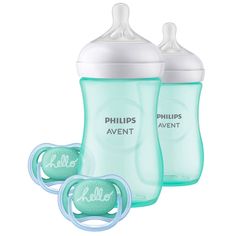 two philips avent bottles with their lids open and one being held by a pacifier