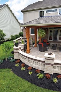 an outdoor patio with seating and landscaping