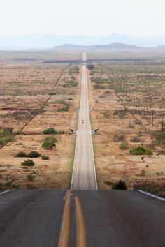 an empty road in the middle of nowhere