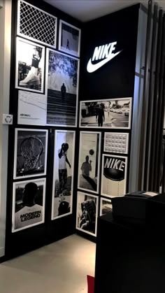 the nike store is decorated with black and white photos, which are hanging on the wall