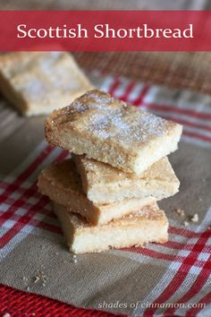 three pieces of shortbread sitting on top of a red and white checkered cloth