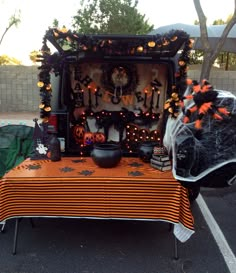 an orange and black table with decorations on it