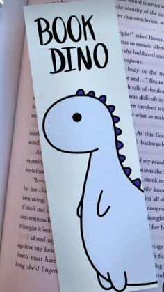 a bookmark with an image of a dinosaur on it and the words, book dino