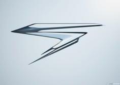 an artistic image of a plane flying in the sky with its wings folded out and it appears to be shaped like a bird's wing