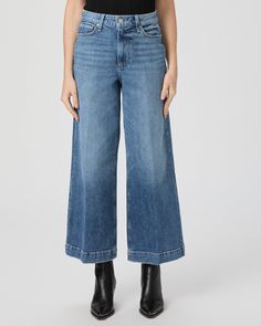 This high rise, extra wide leg has a cropped, ankle length silhouette. This pair is crafted in PAIGE VINTAGE denim with a portion of organic cotton and comes in a light/medium wash with lived-in details. PAIGE VINTAGE takes all the work out of breaking in your favorite pair of vintage jeans. We've combined the comfort of stretch with everything you love about authentic vintage denim to create super soft jeans that feel perfectly lived-in from the very first wear. Eco-positive methods and modern Medium Wash Wide-leg Cropped Jeans With Five Pockets, Wide Leg Medium Wash Cropped Jeans For Fall, Relaxed Fit Medium Wash Wide-leg Cropped Jeans, Relaxed Fit Wide-leg Cropped Jeans In Medium Wash, Medium Wash Wide Leg Cropped Jeans For Fall, Fall Medium Wash Wide Leg Cropped Jeans, Fall Wide Leg Cropped Jeans In Medium Wash, Cropped Wide Leg Denim Blue Pants With Five Pockets, Fall Medium Wash Cropped Wide Leg Pants