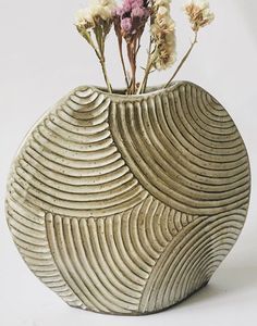 a vase that has some flowers in it