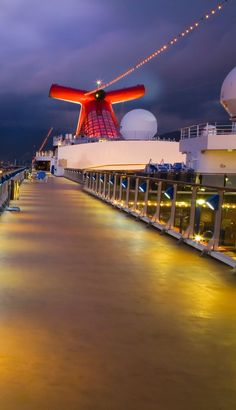 the deck of a cruise ship at night