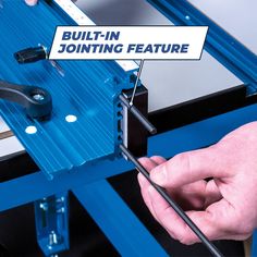 a man is working on a machine with the words built - in jointing feature