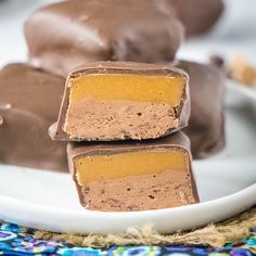 three pieces of chocolate candy on a plate