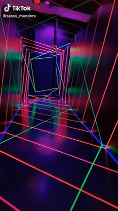 an empty room with neon lights in it