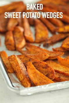 baked sweet potato wedges on a baking sheet with the words baked sweet potato wedges