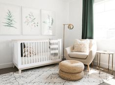 a baby's room with white furniture and green curtains