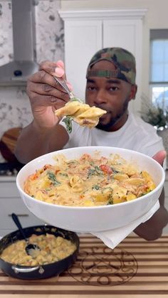 a man holding a spoon full of food