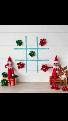 two elfs are playing tic - tac - toe game on the wall