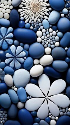 blue and white rocks with flowers on them