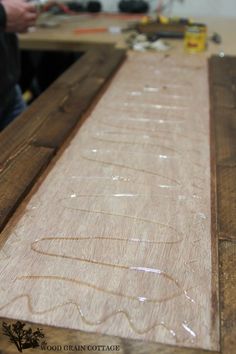 a person working on some wood in a workshop