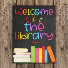 a welcome sign for the library with books on it and a chalkboard in the background