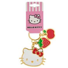 a hello kitty keychain with an apple and strawberry on it