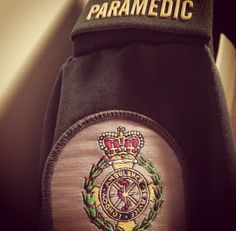 the back of a paramedic's uniform with embroidered emblem