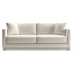 a white couch sitting on top of a wooden frame