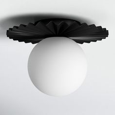 a black and white light fixture hanging from the ceiling