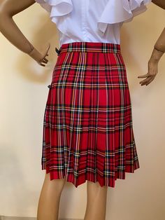 "This beautiful tartan skirt is made from fine soft viscose fabric. Knee lenght 55 cm. Wrap front and pleated full back. SIZE CHART SIZE S - US 6, UK 8, EU 36 bust: bust around 34.5\"/90cm Waist: waist around 27.5\"/70cm Hips: hips around 34.5\"/90cm SIZE M - US 8, UK 10, EU 38 bust: bust around 37.5\"/95cm Waist: waist around 29.5\"/75cm Hips: hips around 37.5\"/95cm SIZE L - US 10, UK 12, EU 40 bust: bust around 39.5\"/100cm Waist: waist around 31.5\"/80cm Hips: hips around 39.5\"/100cm SIZE X Fitted Pleated Plaid Mini Skirt, Fitted Plaid Pleated Mini Skirt, Plaid Pleated Mini Skirt School Uniform, Classic Pleated Plaid Skirt, Plaid Pleated Skort For School Uniform, Pleated Fitted Knee-length Skort, Fitted Pleated Knee-length Skort, Fitted Plaid Skirt For School Uniform, Fitted Pleated Plaid Bottoms